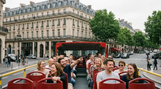 Sightseeing bus tour passing Parisian architecture with tourists enjoying panoramic views